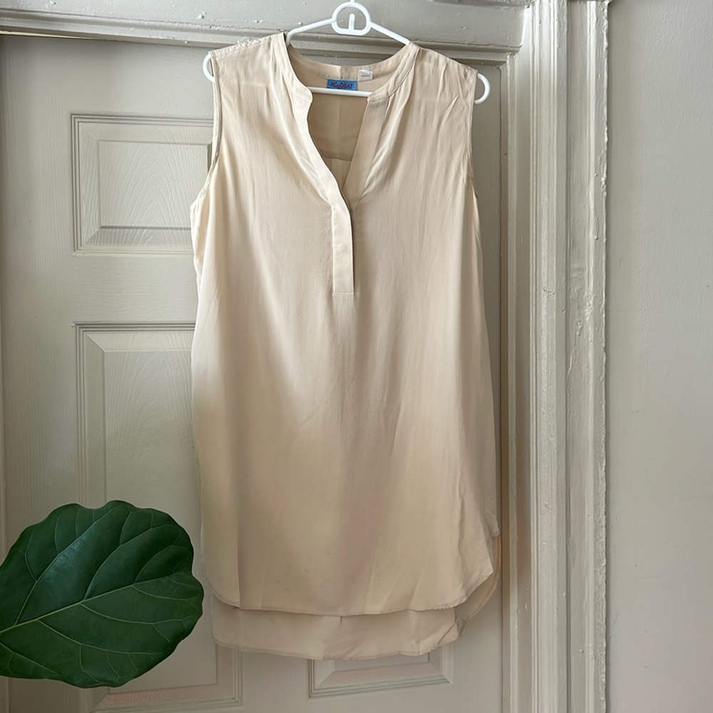 Cream colored, silk tunic style shirt. 100% silk